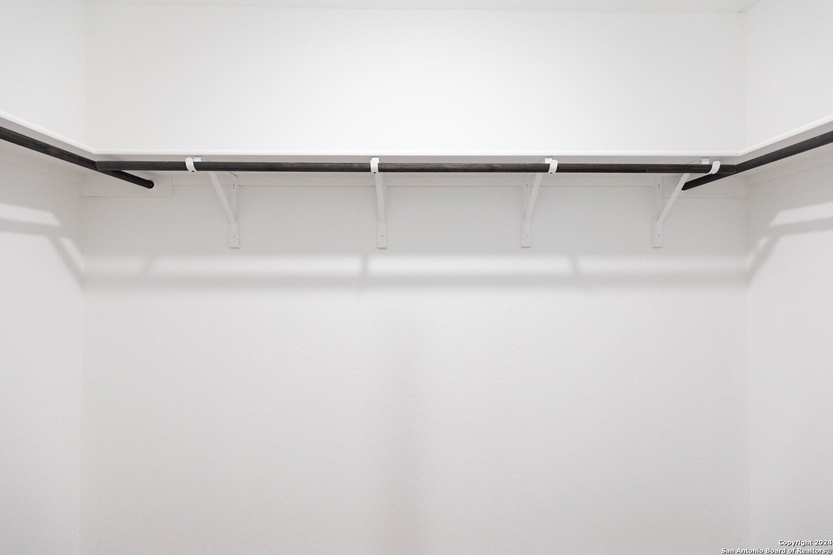 1631 Knoll Ridge New Braunfels, TX 78130 - Photo 17 of 29 a view of a room with shelf on the wall