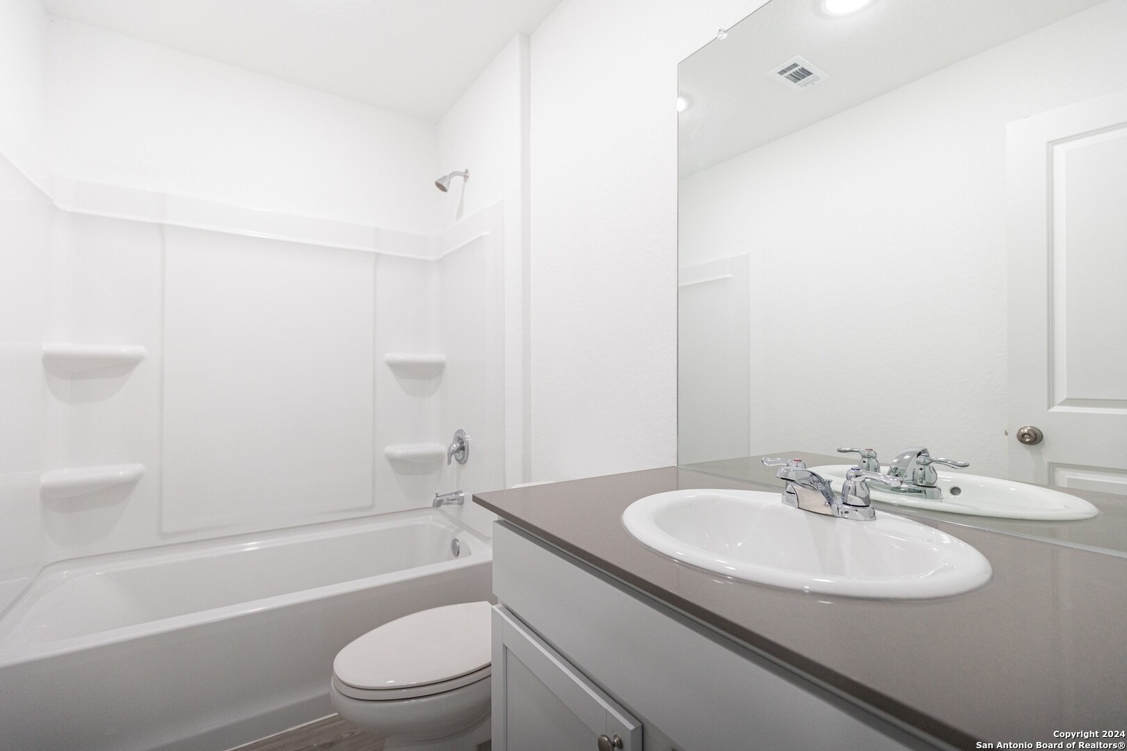 1631 Knoll Ridge New Braunfels, TX 78130 - Photo 20 of 29 a bathroom with a sink toilet and a bathtub