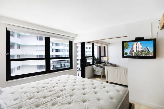 a very nice looking living room with a large window