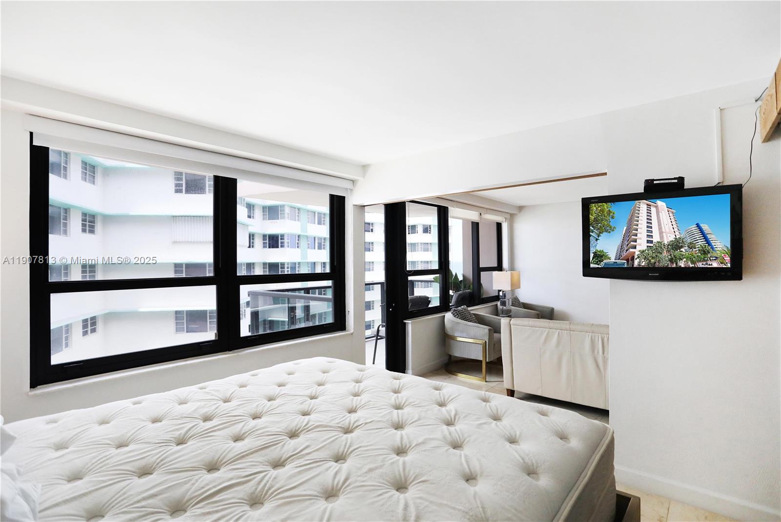 5225 Collins Avenue, Unit 1216 Miami Beach, FL 33140 - Photo 18 of 49 a very nice looking living room with a large window