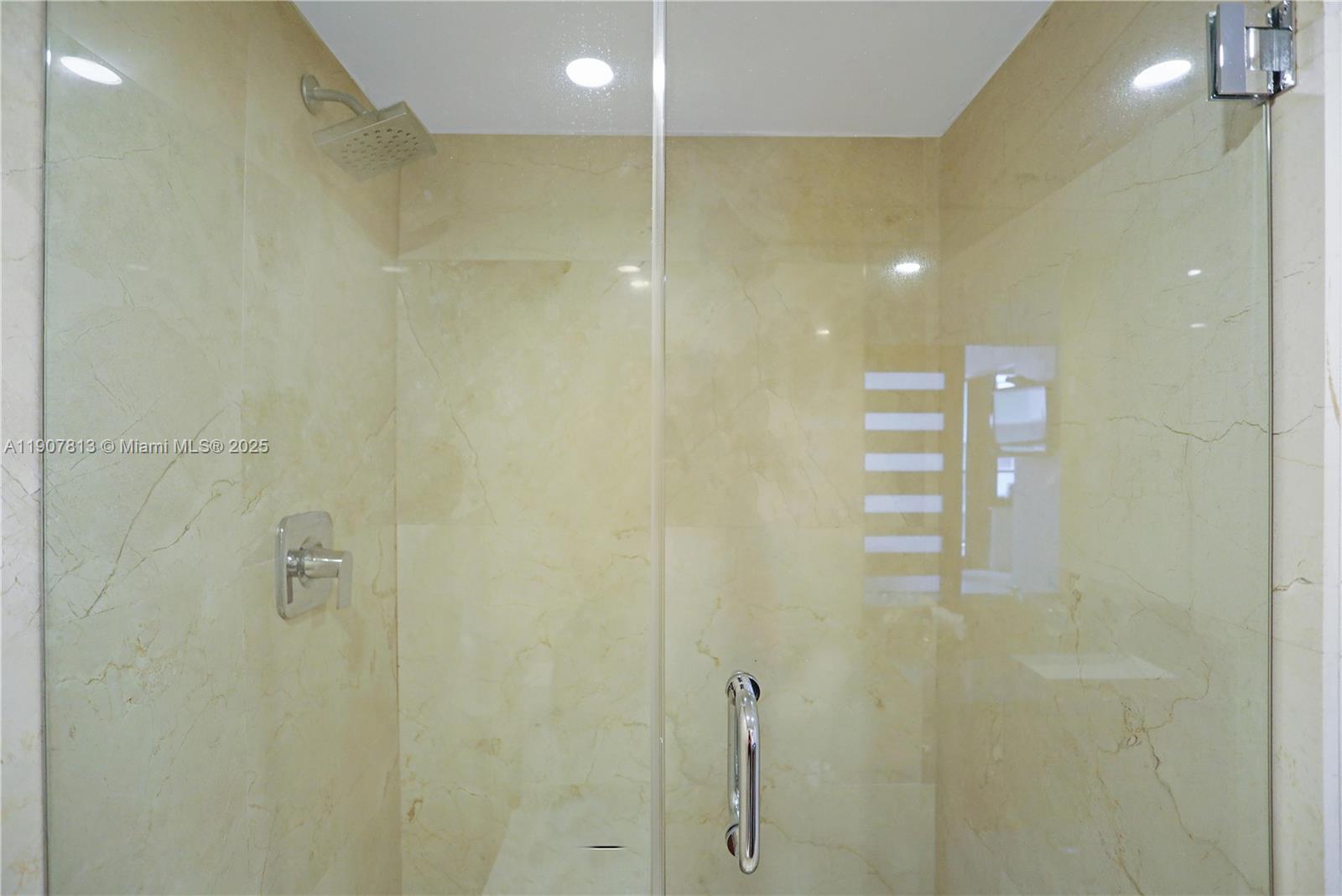 5225 Collins Avenue, Unit 1216 Miami Beach, FL 33140 - Photo 22 of 49 a bathroom with a shower
