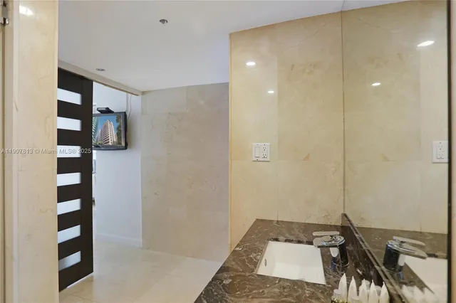 a bathroom with a sink and a shower