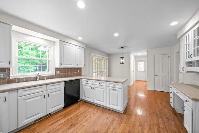 a bathroom with a sink vanity and mirror