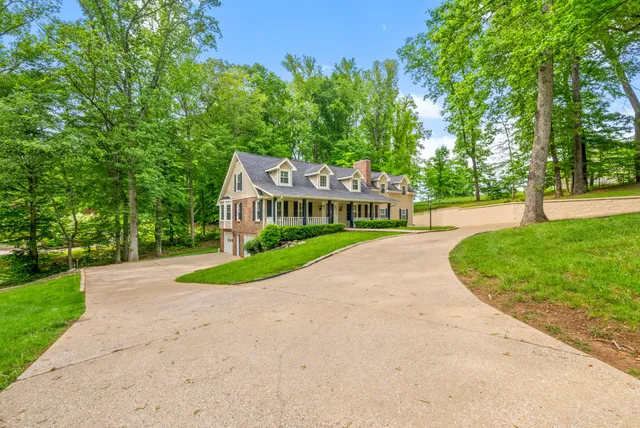 a kitchen with stainless steel appliances a refrigerator sink and microwave