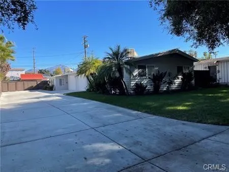 a view of a car is parked in front of a house