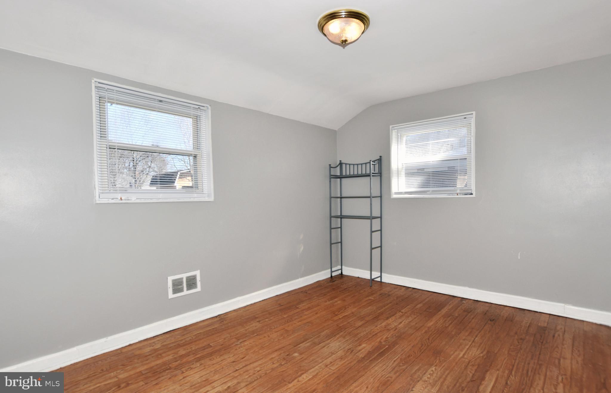 12517 Holdridge Road Silver Spring, MD 20906 - Photo 13 of 22 Bedrooms with double windows and hardwood floors.