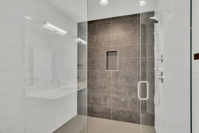 a bathroom with a shower and a bathtub
