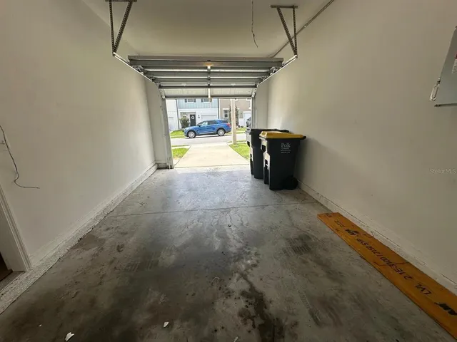 a view of a house with backyard and porch