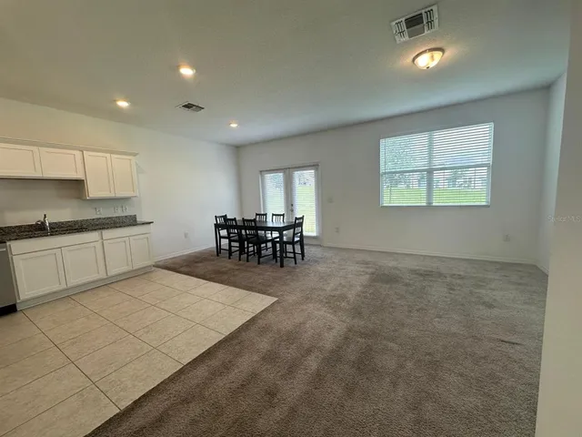 a view of a kitchen and dining room