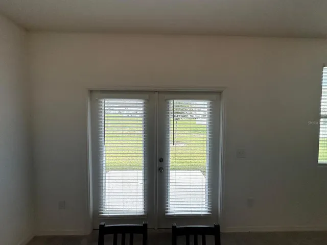 a bathroom with a granite countertop toilet and a shower