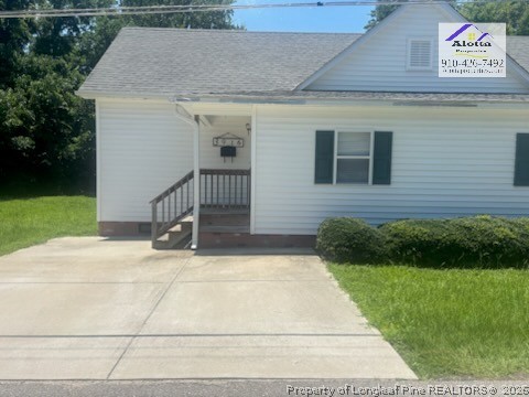 3916 Middle Street Hope Mills, NC 28348 - Photo 1 of 12 a view of house with yard and garage
