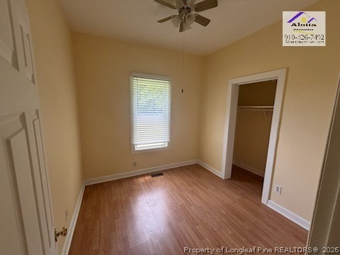 3916 Middle Street Hope Mills, NC 28348 - Photo 7 of 12 an empty room with wooden floor and windows