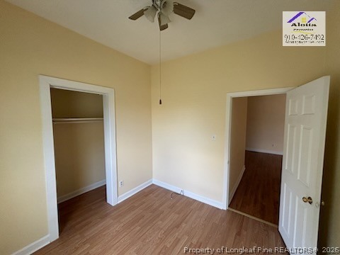 3916 Middle Street Hope Mills, NC 28348 - Photo 8 of 12 an empty room with wooden floor and a ceiling fan