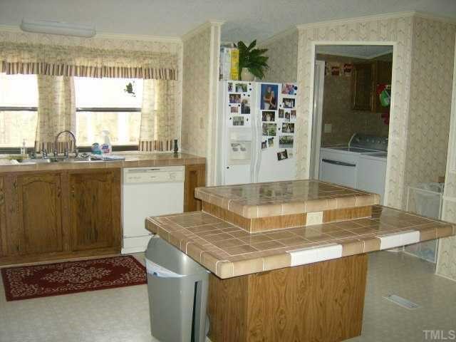 449 Wintergreen Road Timberlake, NC 27583 - Photo 3 of 12 a dining table with next to a window
