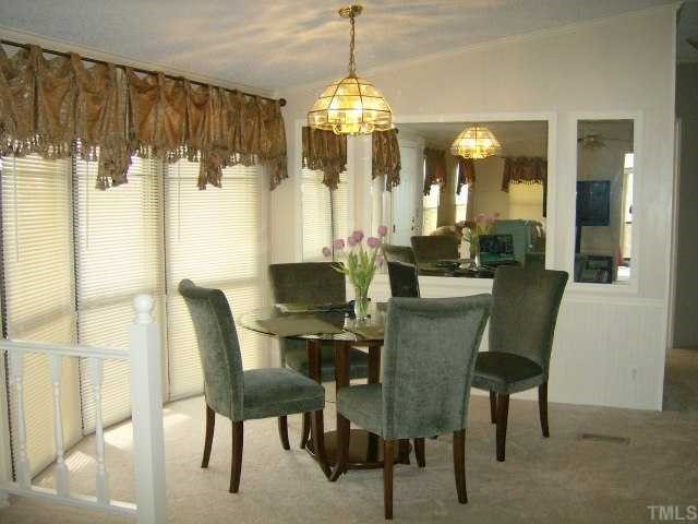 449 Wintergreen Road Timberlake, NC 27583 - Photo 5 of 12 a dining room with furniture and window