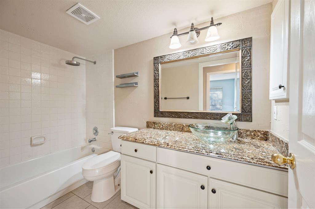 2504 Springhill Drive Grapevine, TX 76051 - Photo 24 of 32 Bathroom with shower combination, vanity, and light tile patterned floors