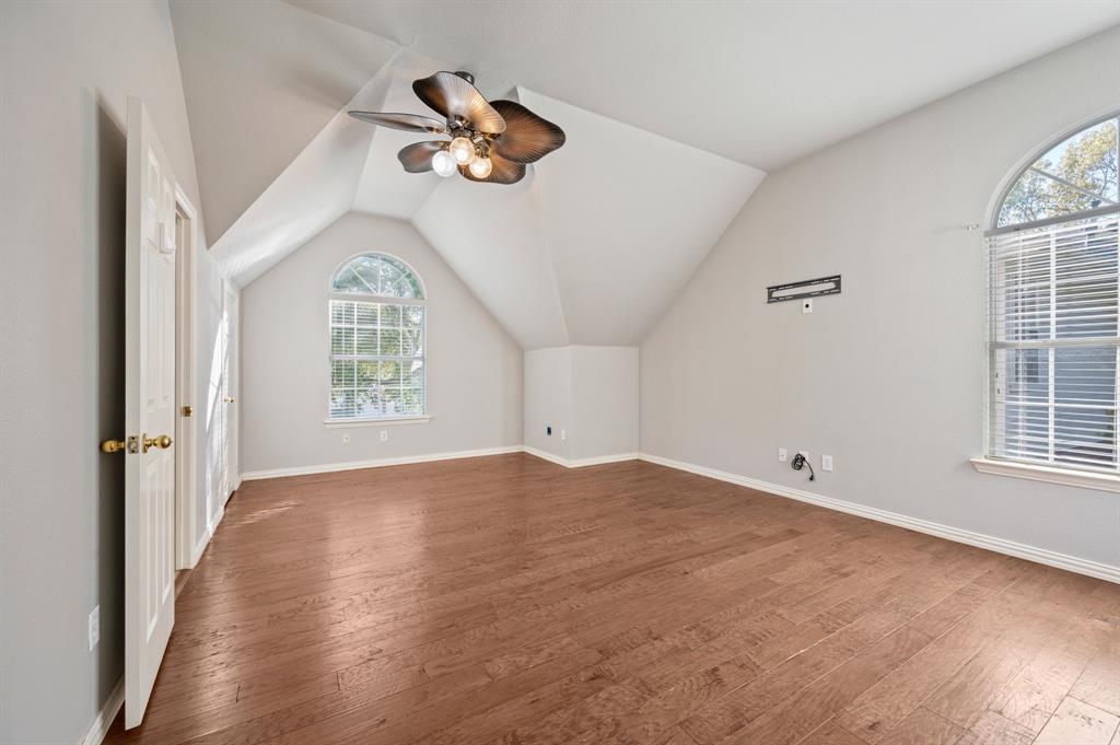 2504 Springhill Drive Grapevine, TX 76051 - Photo 25 of 32 Bedroom featuring hardwood / wood-style floors, lofted ceiling, and a ceiling fan