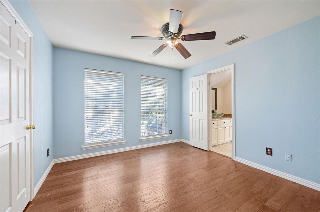 2504 Springhill Drive Grapevine, TX 76051 - Photo 27 of 32 Bedroom featuring hardwood / wood-style floors, a ceiling fan, and connected bathroom