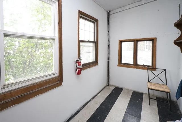 a car parked in front of a brick house