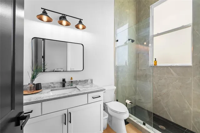 a bedroom with bed and a window