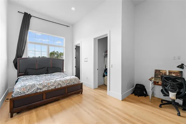 a bedroom with a bed and furniture