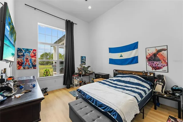 a living room with furniture and large windows