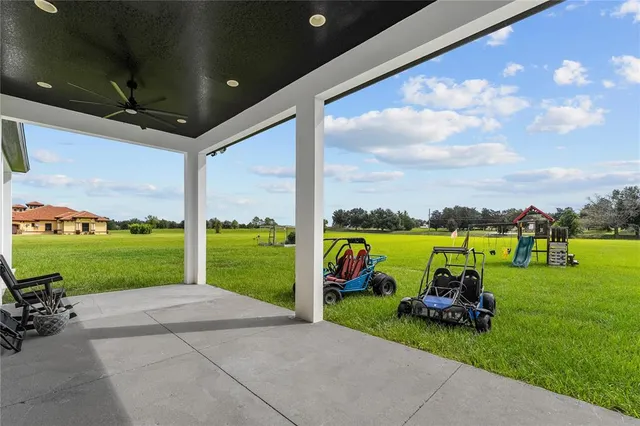 an aerial view of a house with a big yard