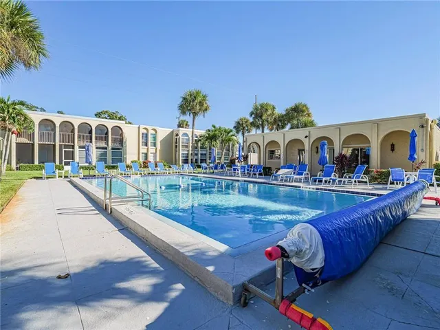 a view of swimming pool with outdoor seating