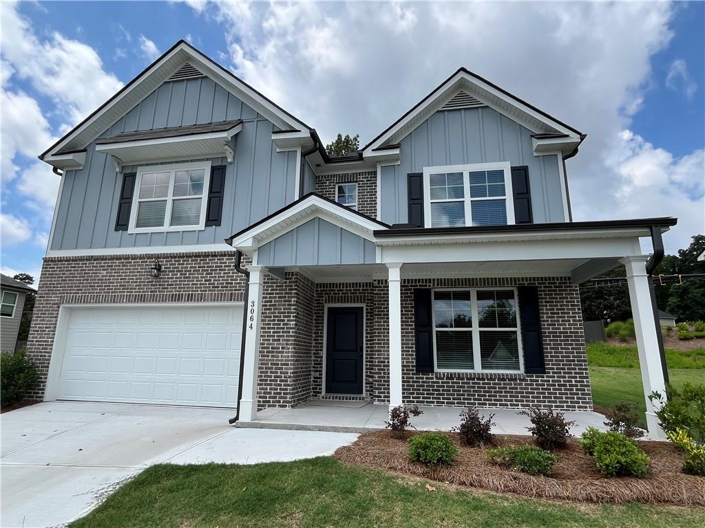 3064 Steinbeck Way Atlanta, GA 30344 - Photo 1 of 1 a front view of a house with garden
