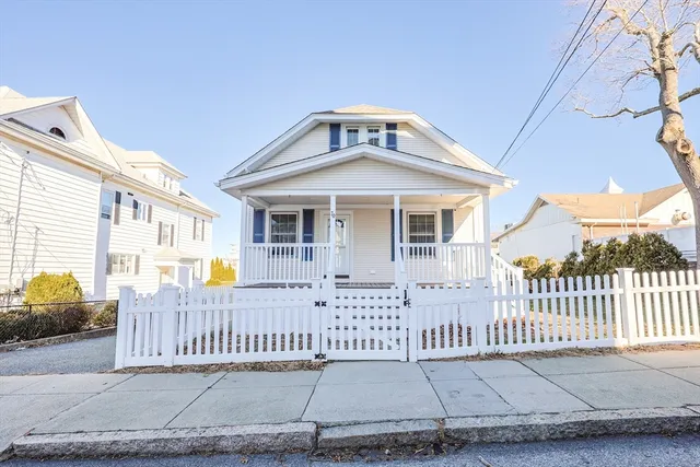 a front view of a house with a fence