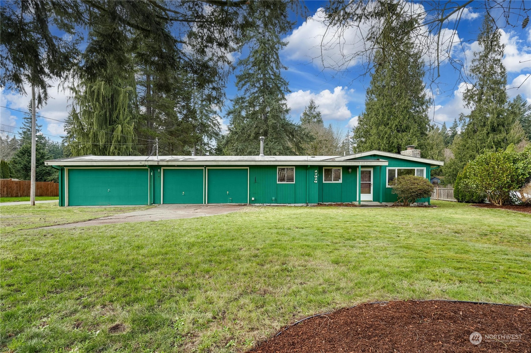 17316 North Road Bothell, WA 98012 - Photo 1 of 32 a front view of a house with a garden