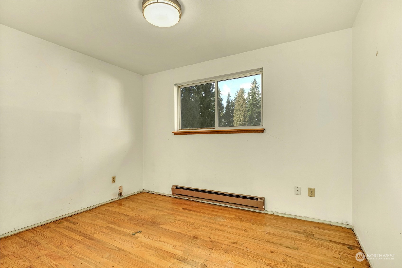 17316 North Road Bothell, WA 98012 - Photo 16 of 32 a view of empty room with wooden floor