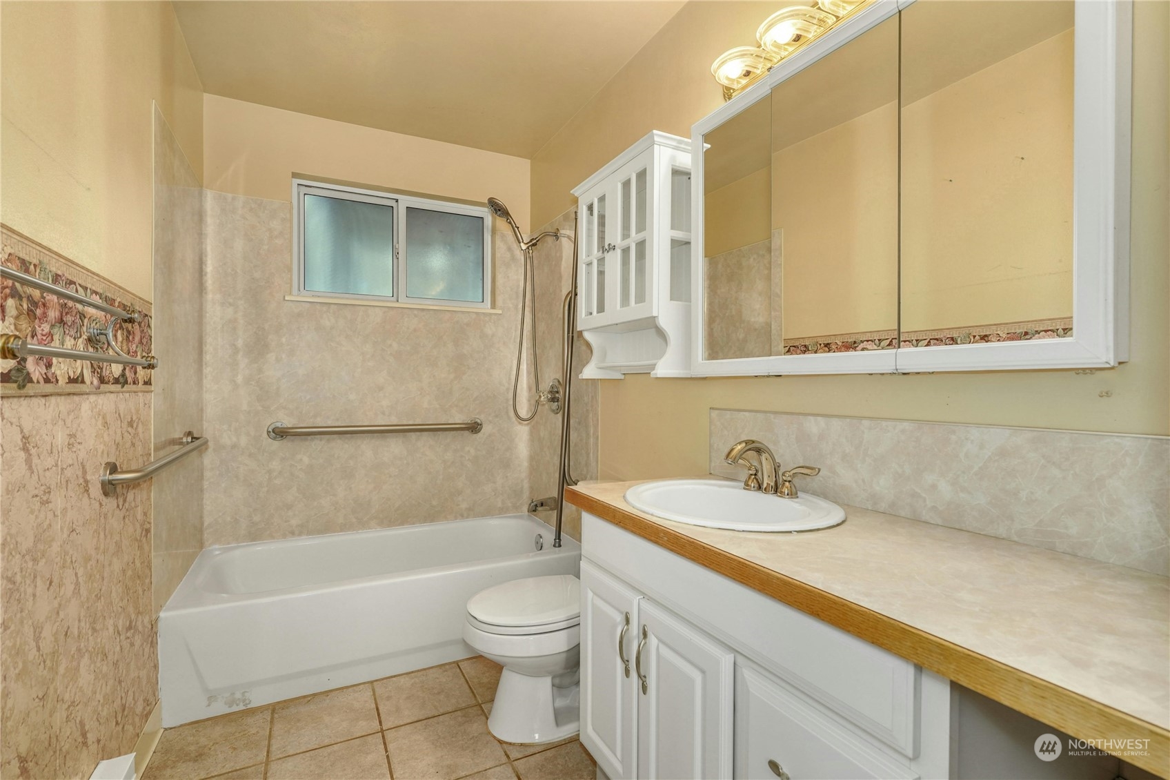 17316 North Road Bothell, WA 98012 - Photo 17 of 32 a bathroom with a sink a toilet and bathtub