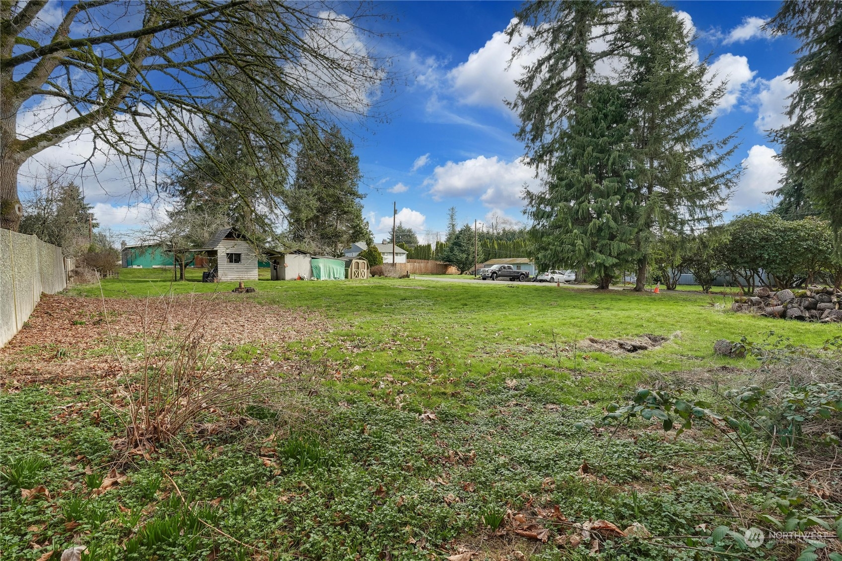 17316 North Road Bothell, WA 98012 - Photo 27 of 32 a view of a field with large trees