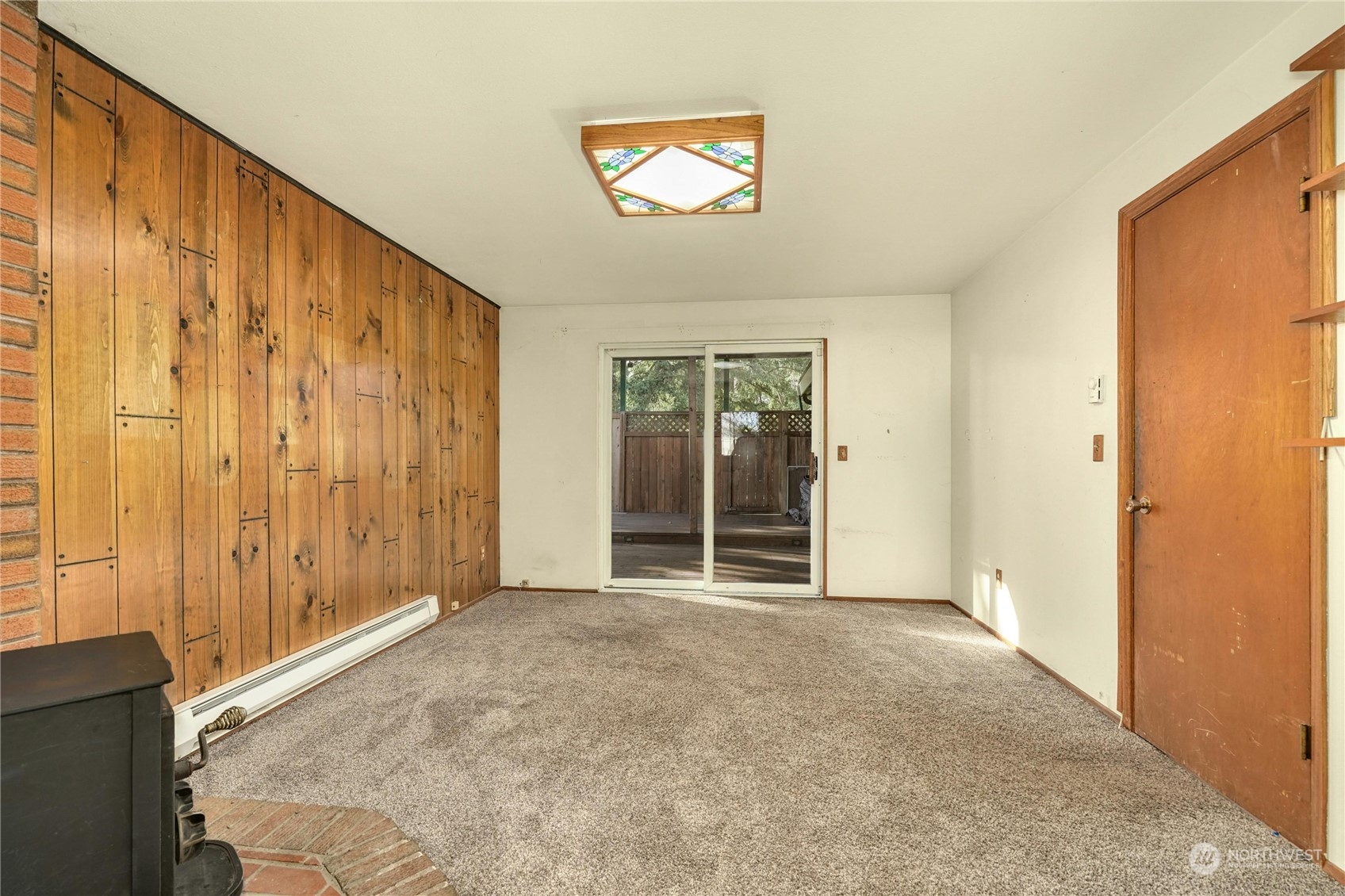 17316 North Road Bothell, WA 98012 - Photo 9 of 32 a view of an empty room with a window