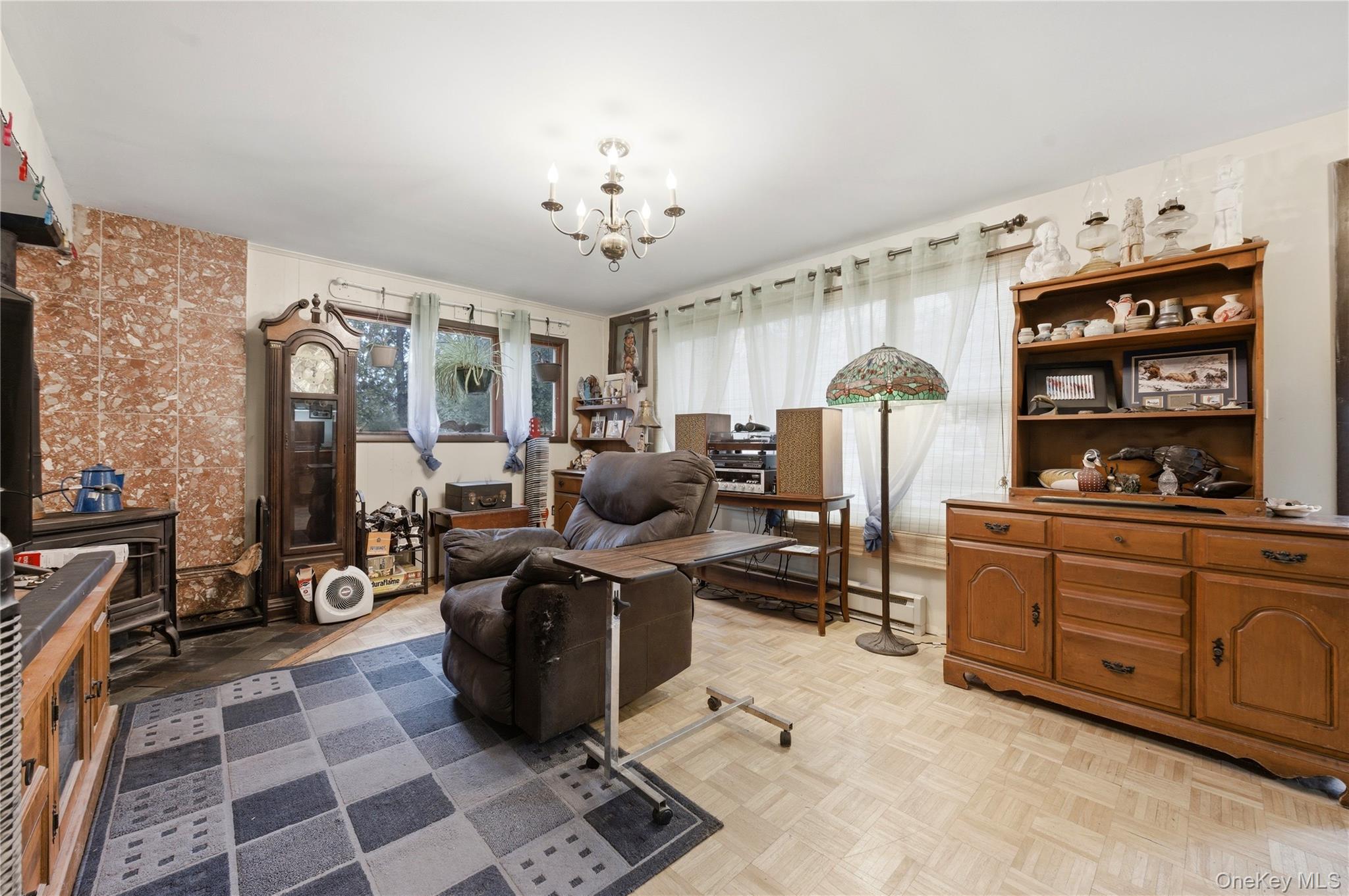 35 Quiat Road Mountain Dale, NY 12763 - Photo 3 of 27 Living room with parquet flooring, baseboard heating, and hanging lights