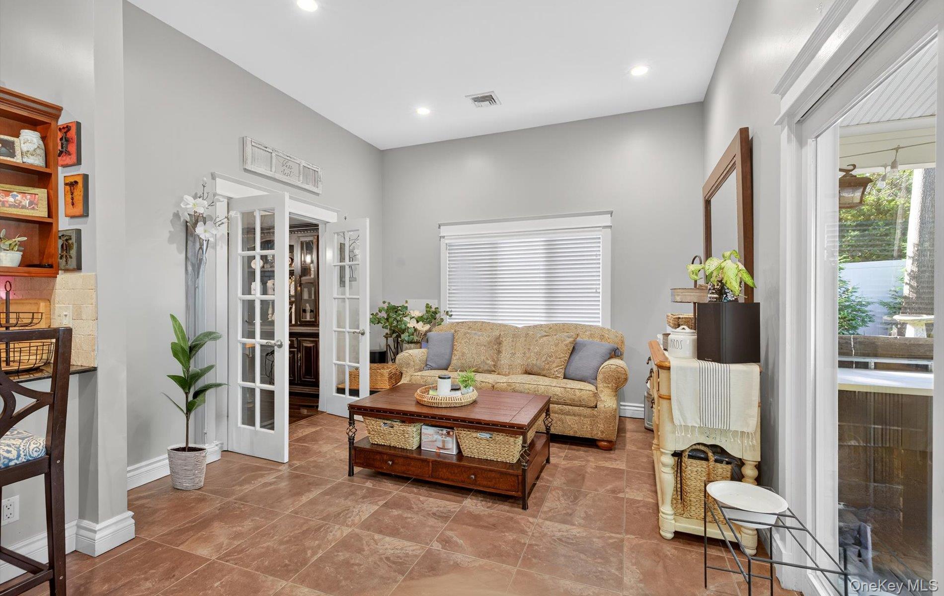 171 Dix Hills Road Dix Hills, NY 11746 - Photo 11 of 39 a living room with furniture and a potted plant