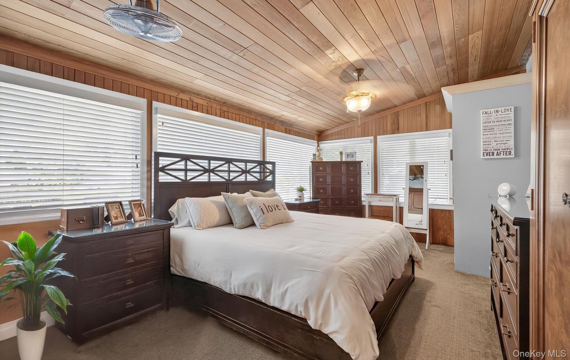 171 Dix Hills Road Dix Hills, NY 11746 - Photo 16 of 39 a bedroom with a bed potted plant with the outer view