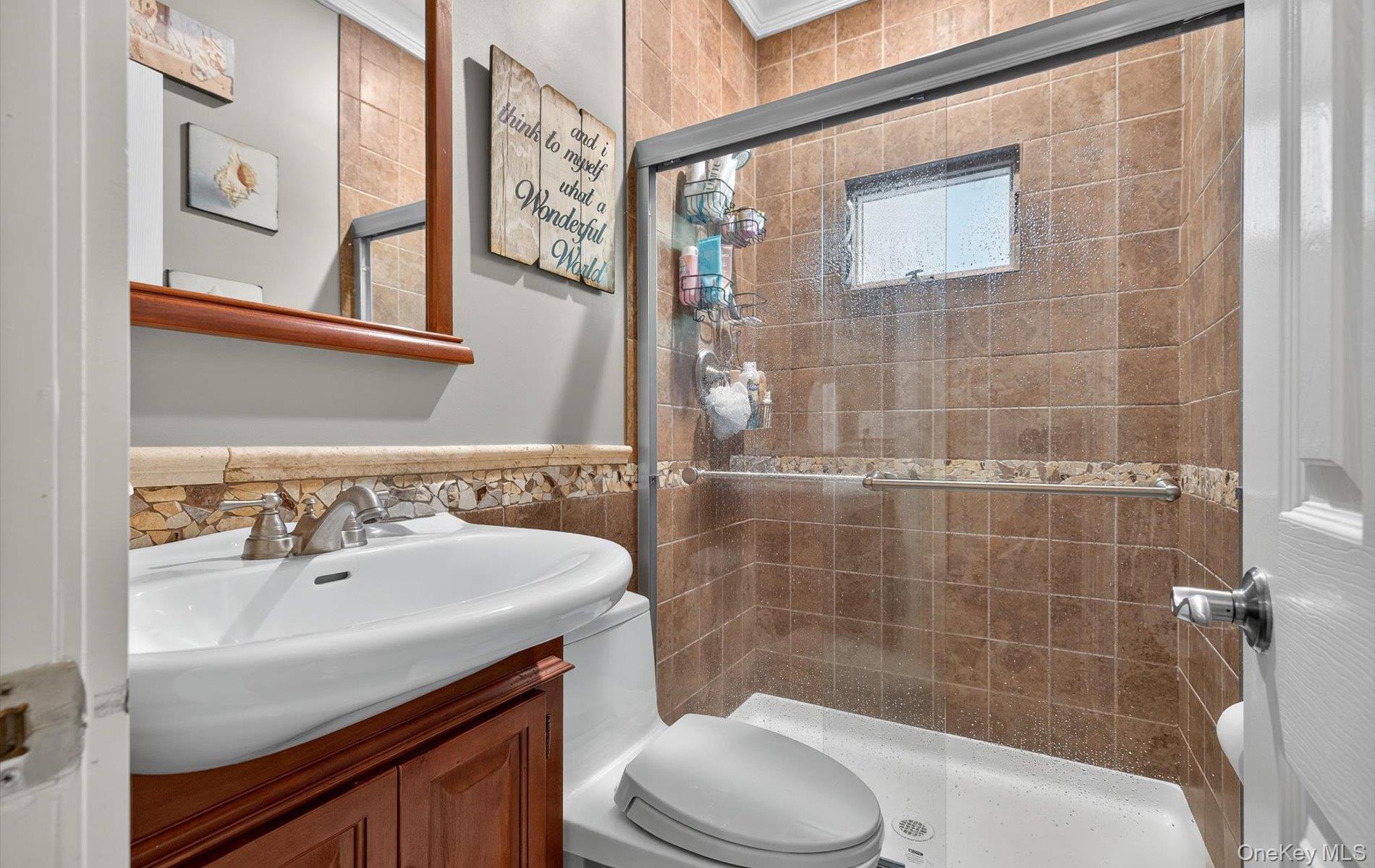 171 Dix Hills Road Dix Hills, NY 11746 - Photo 17 of 39 a bathroom with a sink a toilet and shower