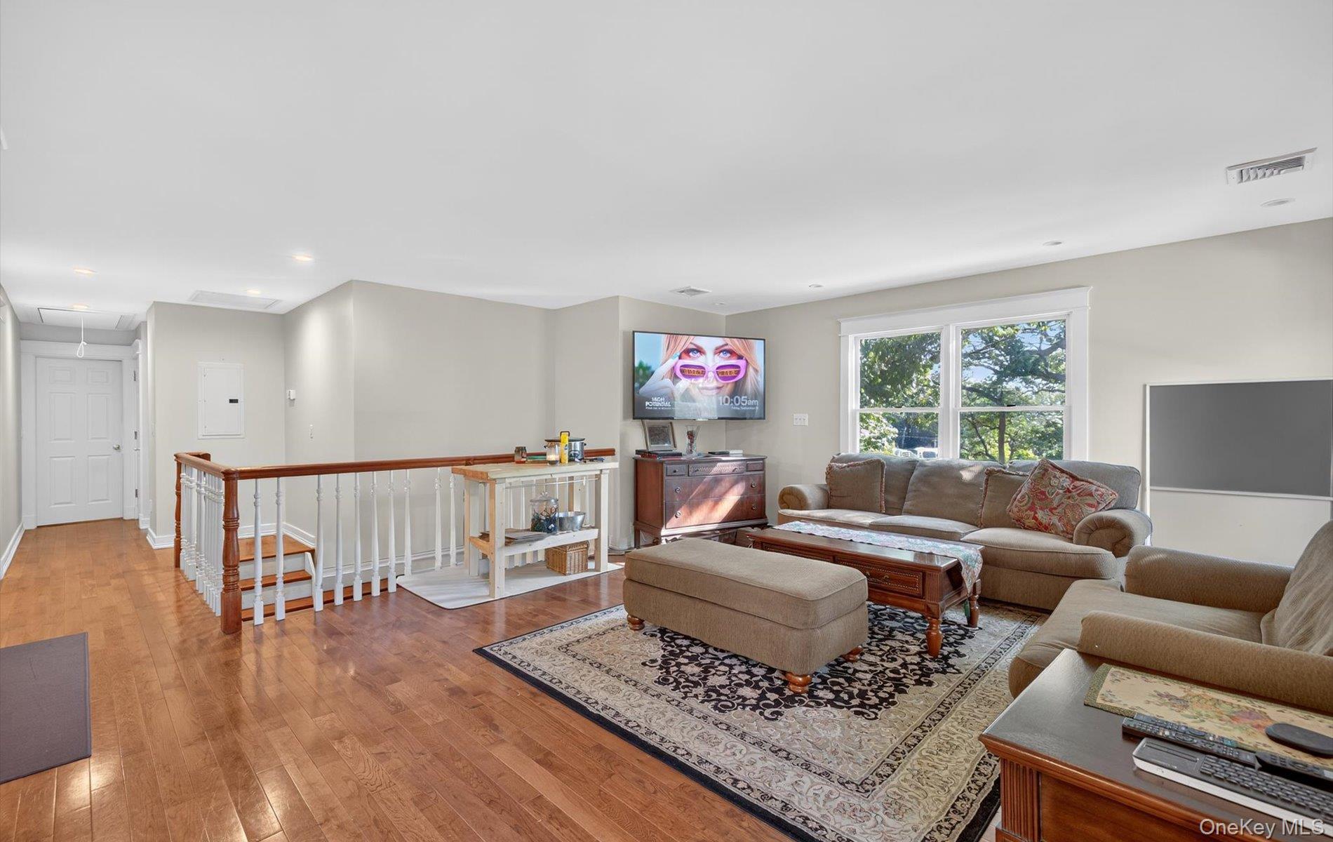 171 Dix Hills Road Dix Hills, NY 11746 - Photo 22 of 39 a living room with furniture and a wooden floor