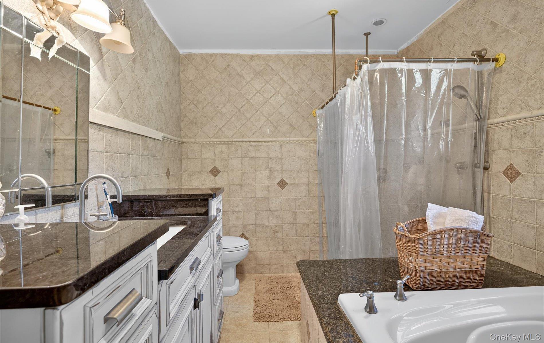 171 Dix Hills Road Dix Hills, NY 11746 - Photo 25 of 39 a bathroom with a sink and a mirror