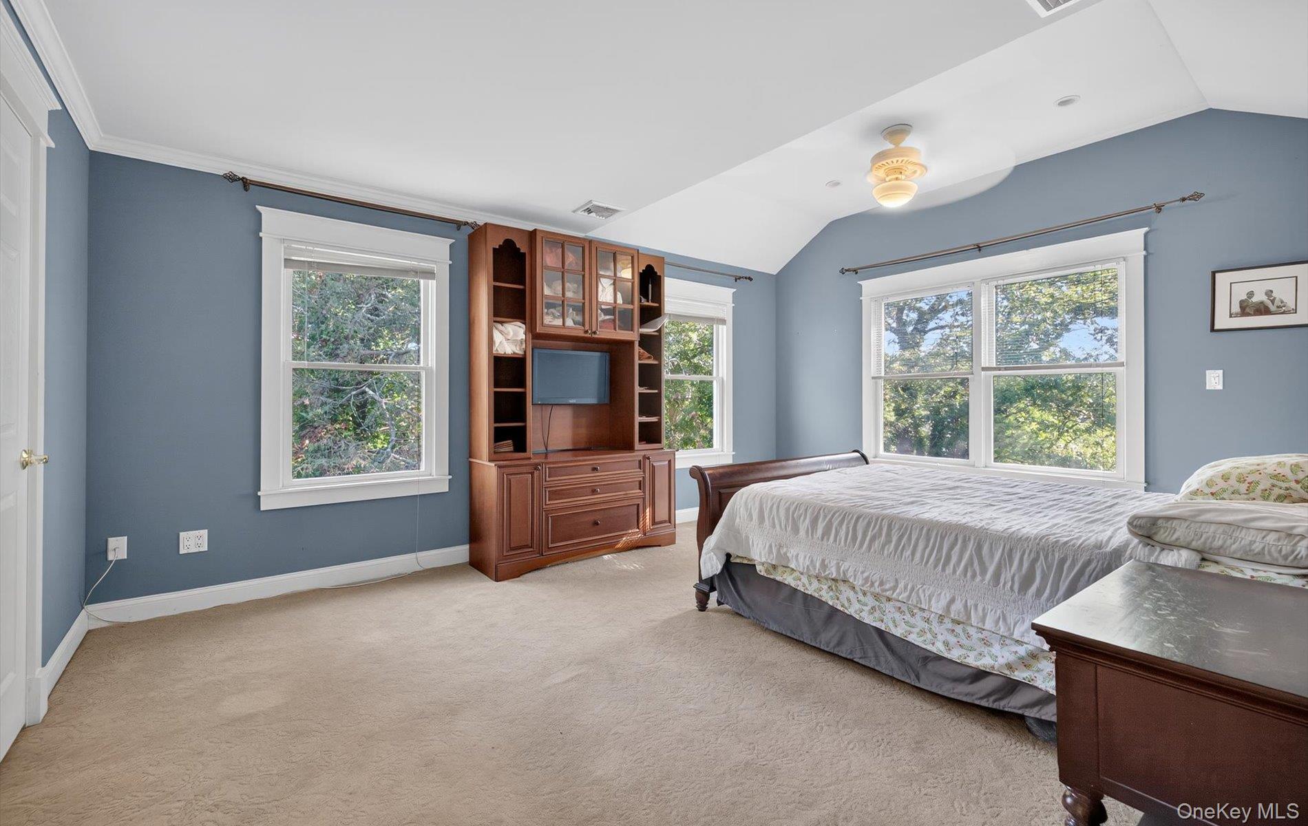 171 Dix Hills Road Dix Hills, NY 11746 - Photo 27 of 39 a bed sitting in a bedroom next to a window