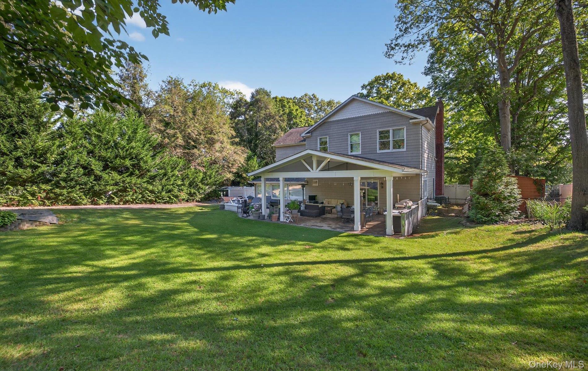 171 Dix Hills Road Dix Hills, NY 11746 - Photo 31 of 39 a aerial view of a house next to a big yard with large trees