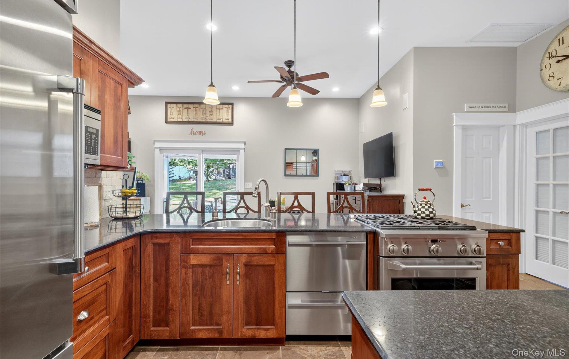 171 Dix Hills Road Dix Hills, NY 11746 - Photo 5 of 39 a kitchen with kitchen island granite countertop a sink cabinets and stainless steel appliances
