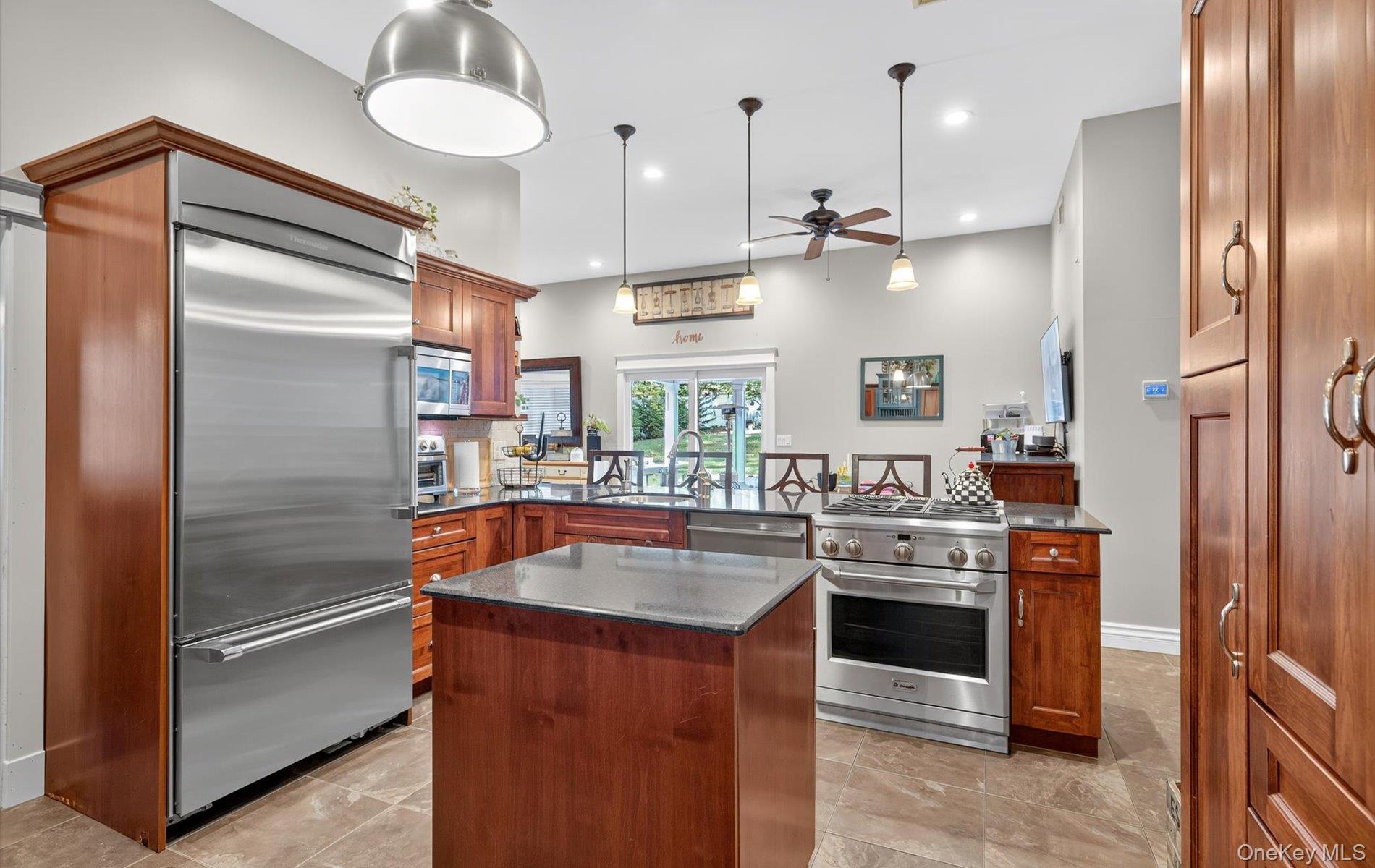 171 Dix Hills Road Dix Hills, NY 11746 - Photo 6 of 39 a kitchen with stainless steel appliances granite countertop a refrigerator a sink and a stove