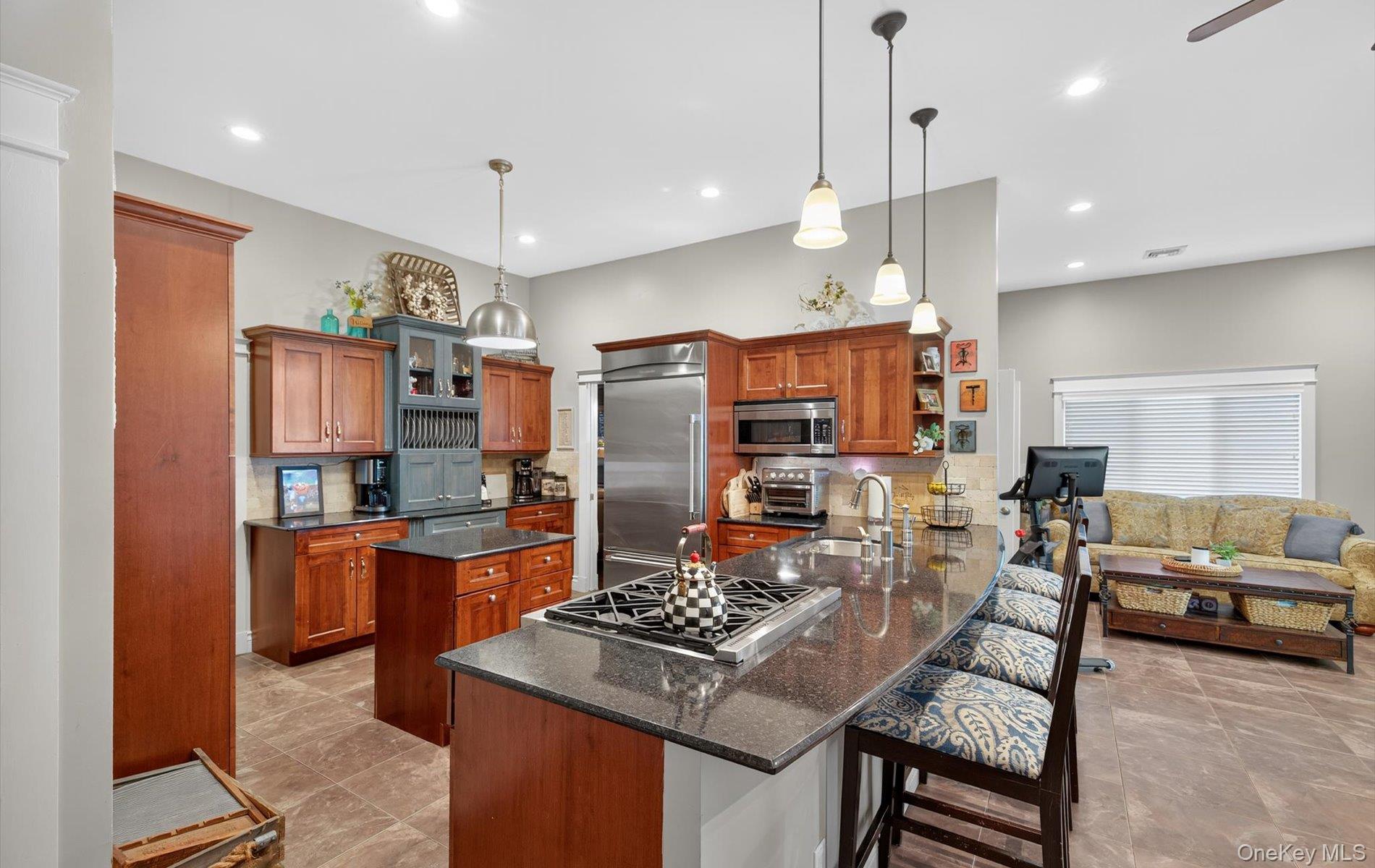 171 Dix Hills Road Dix Hills, NY 11746 - Photo 7 of 39 a kitchen with stainless steel appliances granite countertop a stove oven and a refrigerator