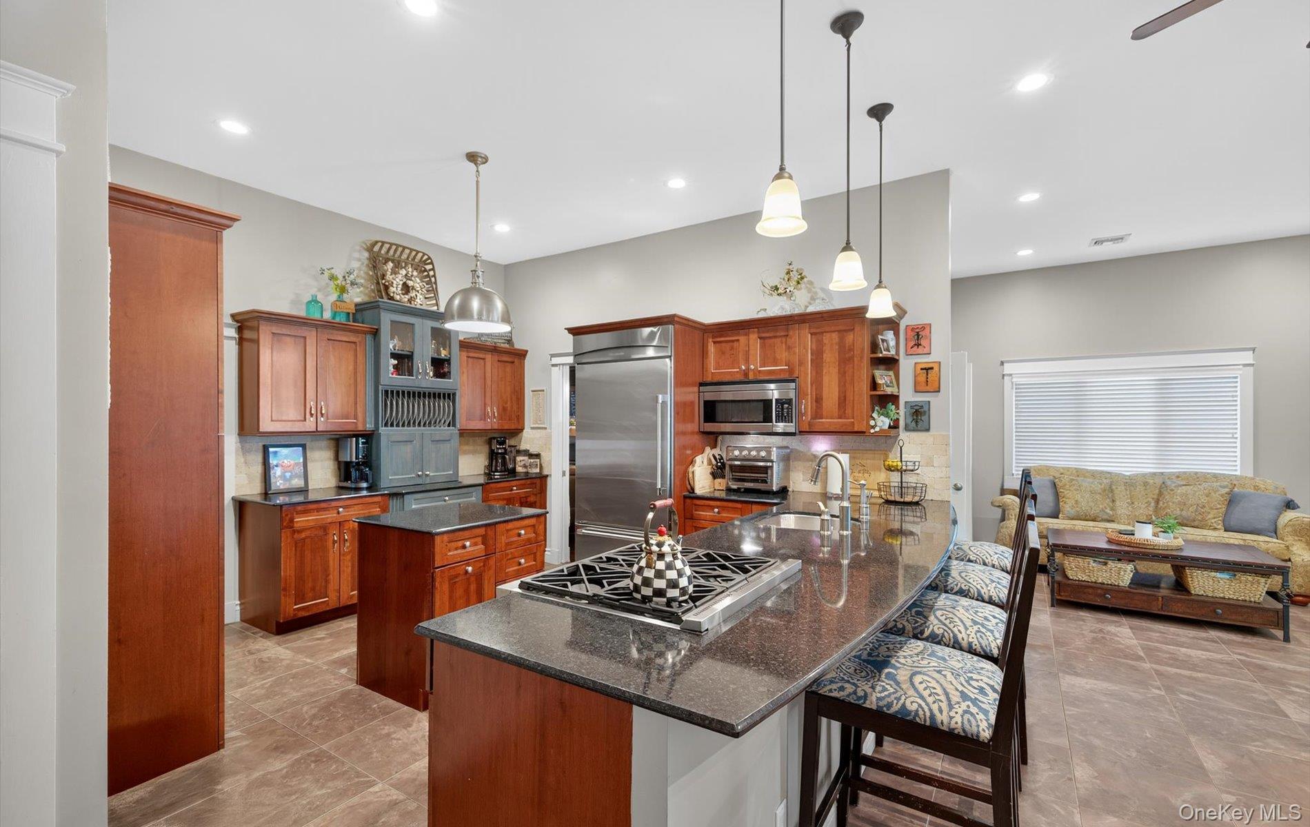 171 Dix Hills Road Dix Hills, NY 11746 - Photo 10 of 39 a kitchen with stainless steel appliances granite countertop a stove and a refrigerator