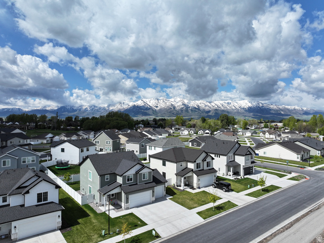 384 Ropelato Drive Nibley, UT 84321 - Photo 22 of 25 Aerial view of residential area with mountains