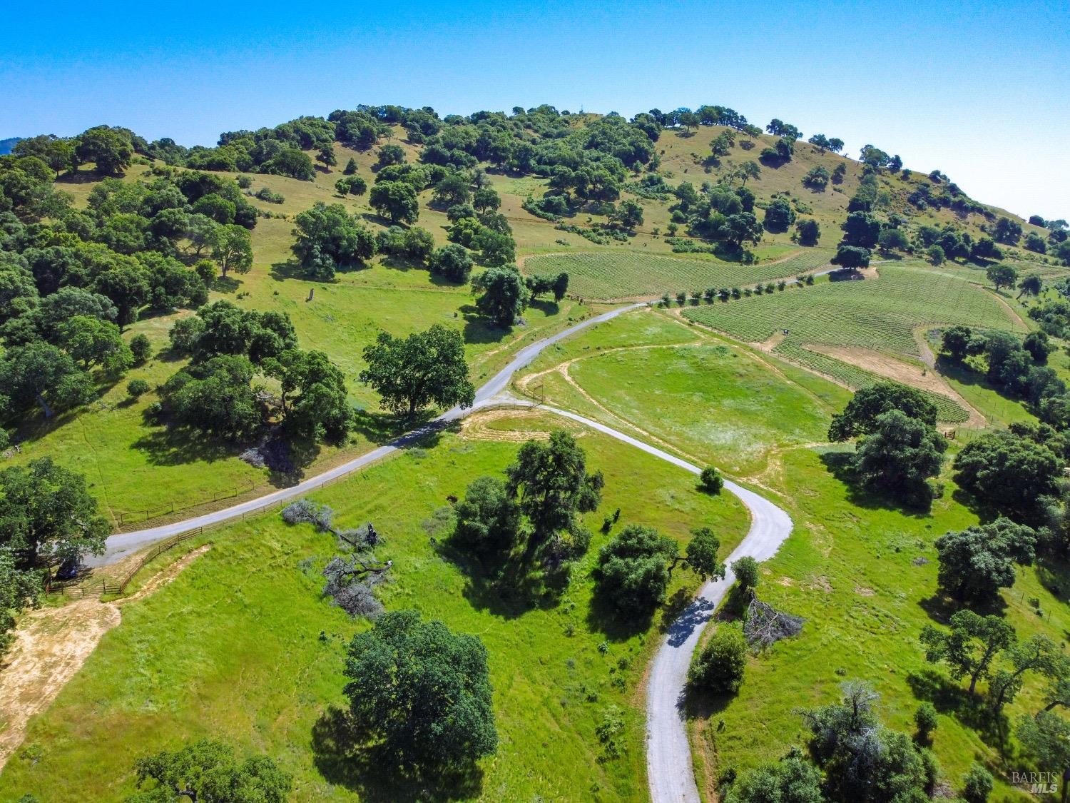 an aerial view of a golf course with outdoor space