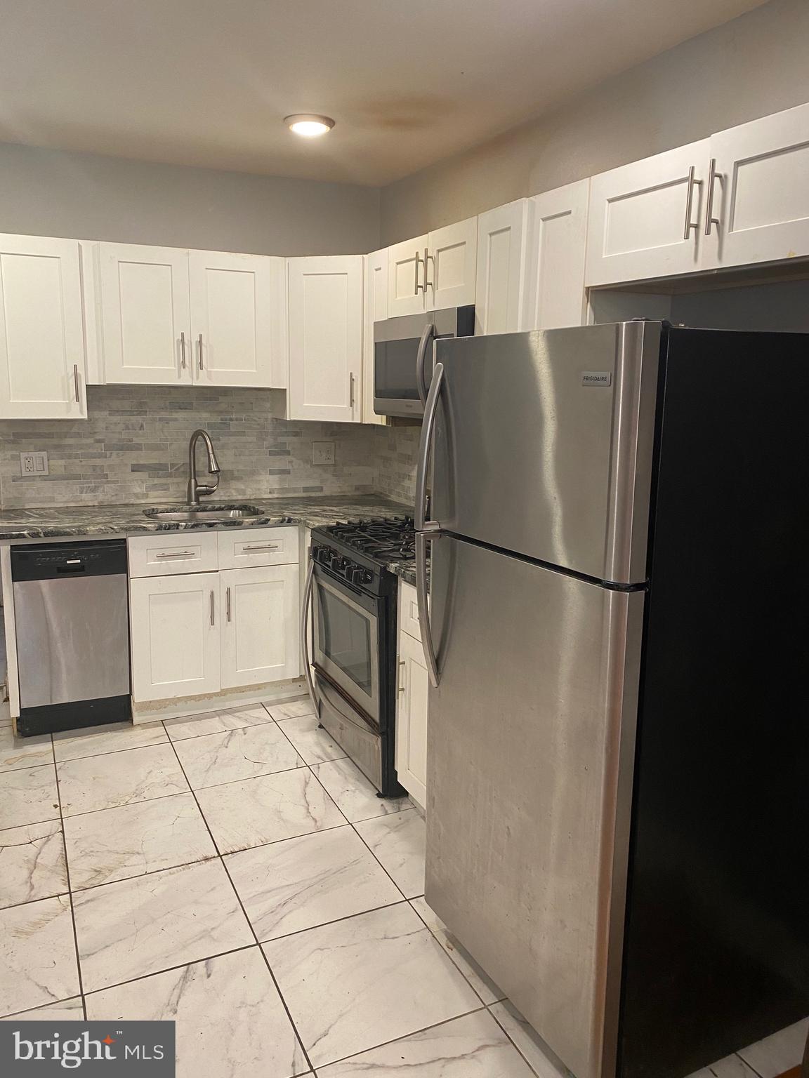 2331 North Cleveland Street Philadelphia, PA 19132 - Photo 3 of 7 Kitchen: stainless steel, granite, new cabinets